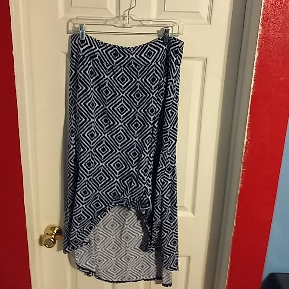 Skirt in a soft blue and white polyester blend.